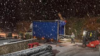 Packing a delivery on a snowy evening