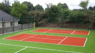 terracotta coloured artificial grass for basketball court