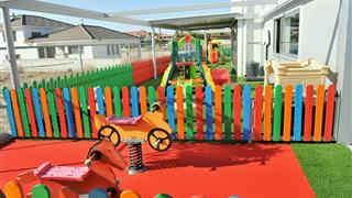 VerdeSward Red in an outside playground