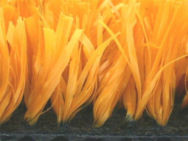 side view of yellow artificial grass