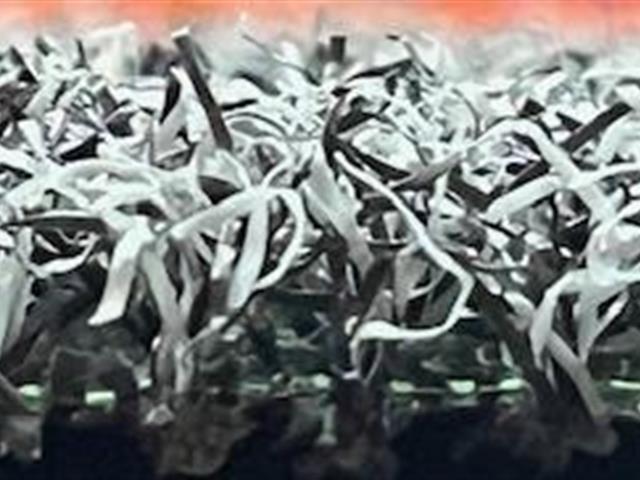 side view of grey artificial grass