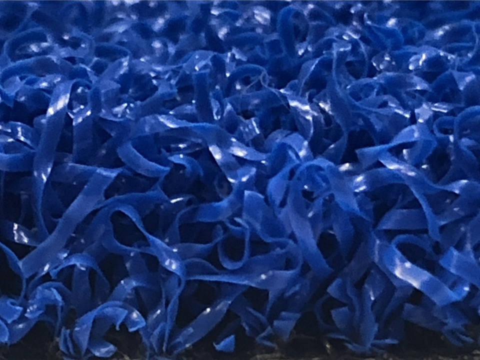 side view of blue artificial grass
