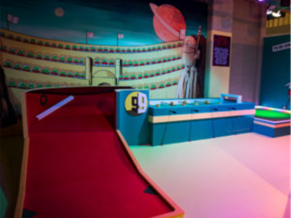 red artificial grass golfing ramp