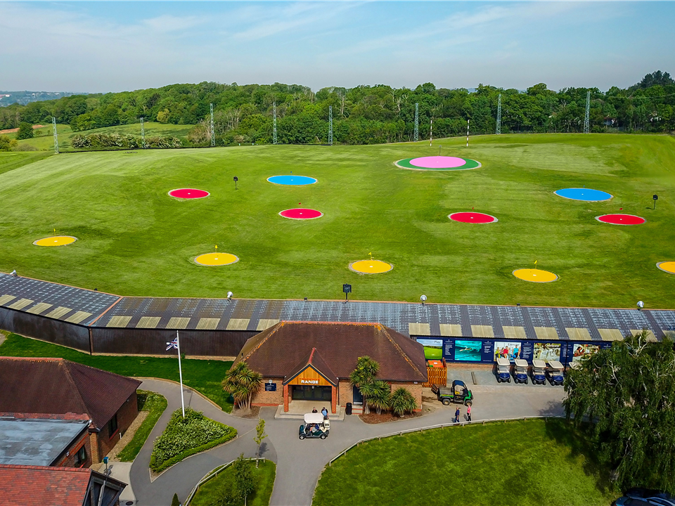 target green with multi coloured artifical grass