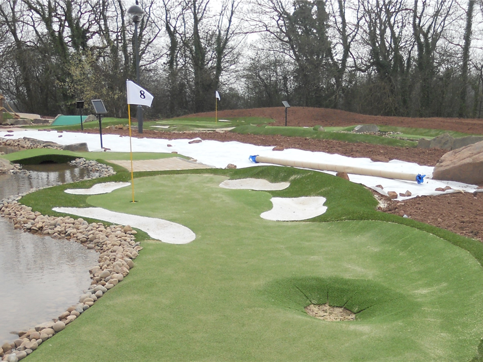 scandinavian minigolf course with white artificial grass