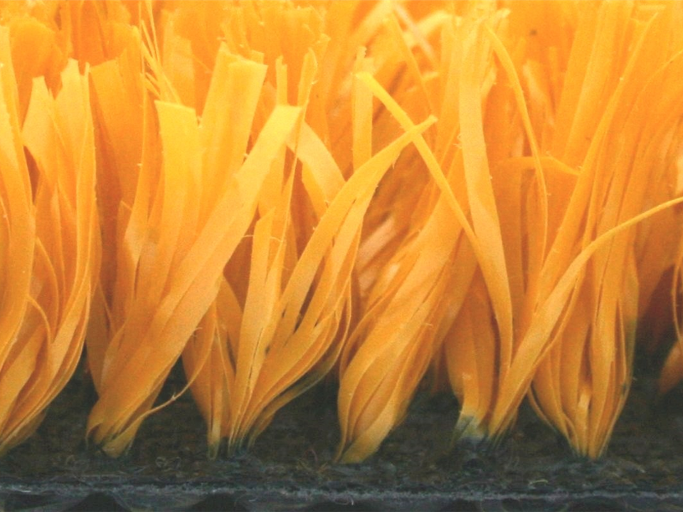 side view of yellow artificial grass