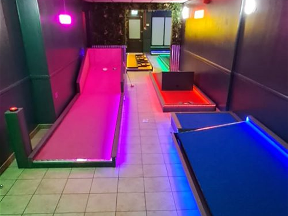 verde prime pink at a neon crazy golf course