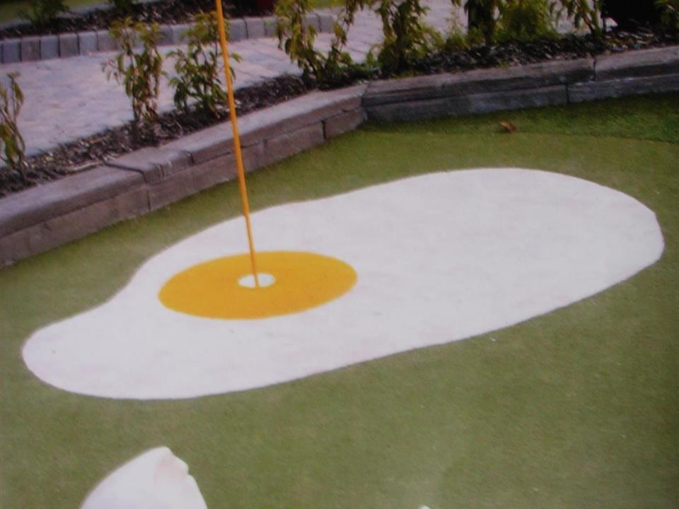 egg patterned mini golf made out of white verdeturf